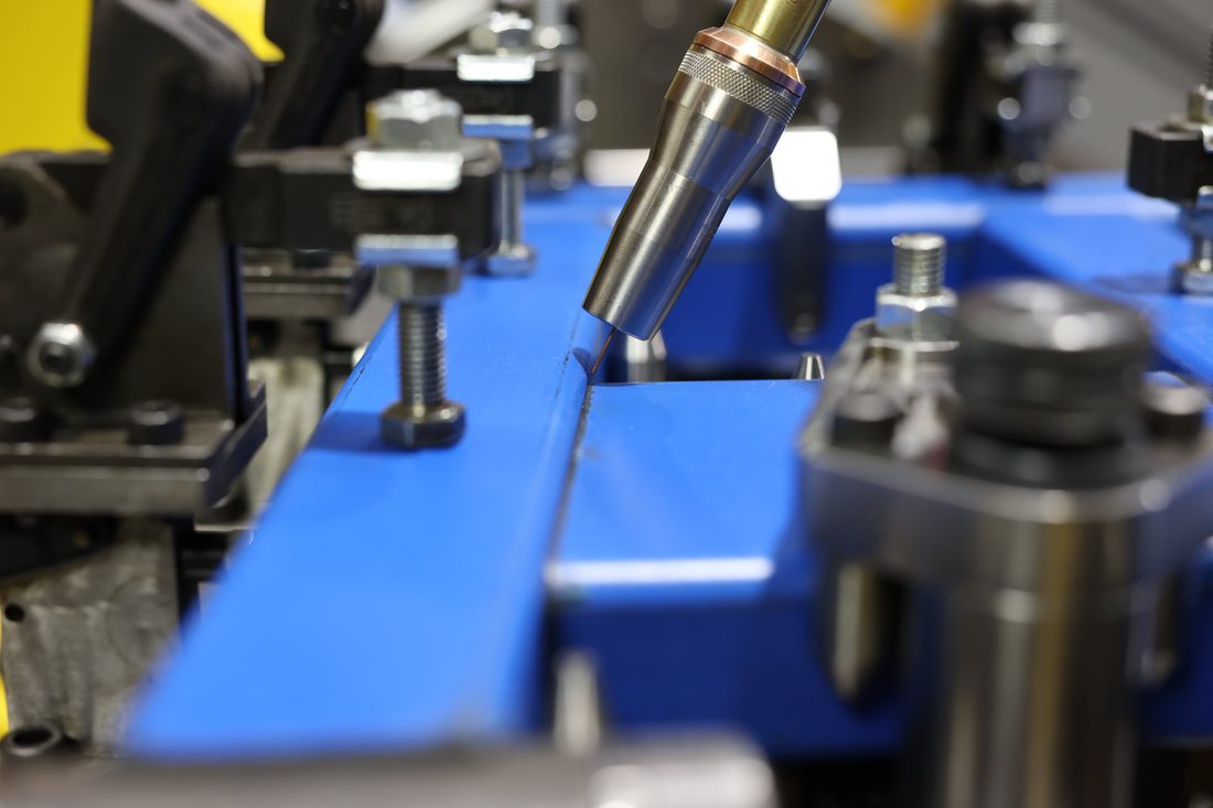 Robotic welding torch on a fixtured workpiece